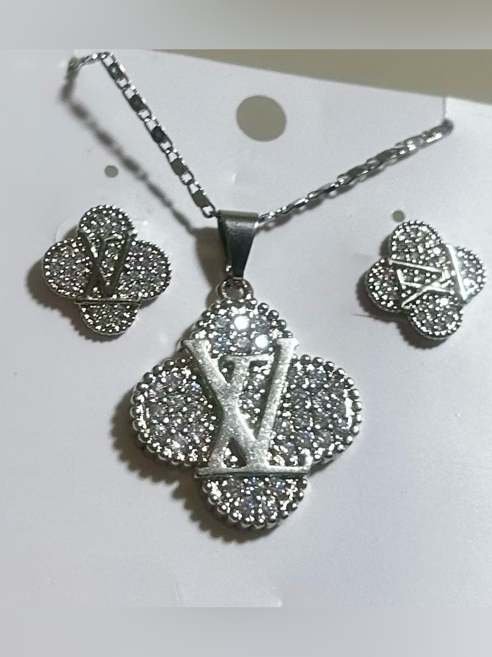 Sparkling Silver Clover Pendant Necklace with Matching Stud Earrings